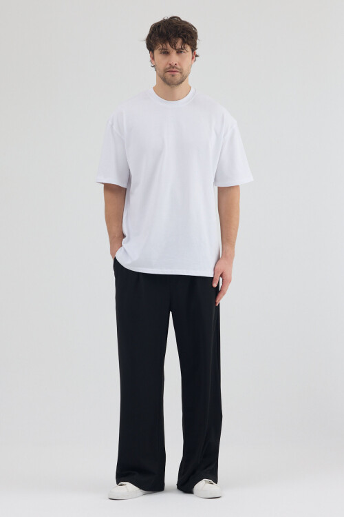 Siyah Dalgıç Kumaş Şardonlu Önü Pile ve Cep Detaylı Rahat Kesim Baggy Pantolon